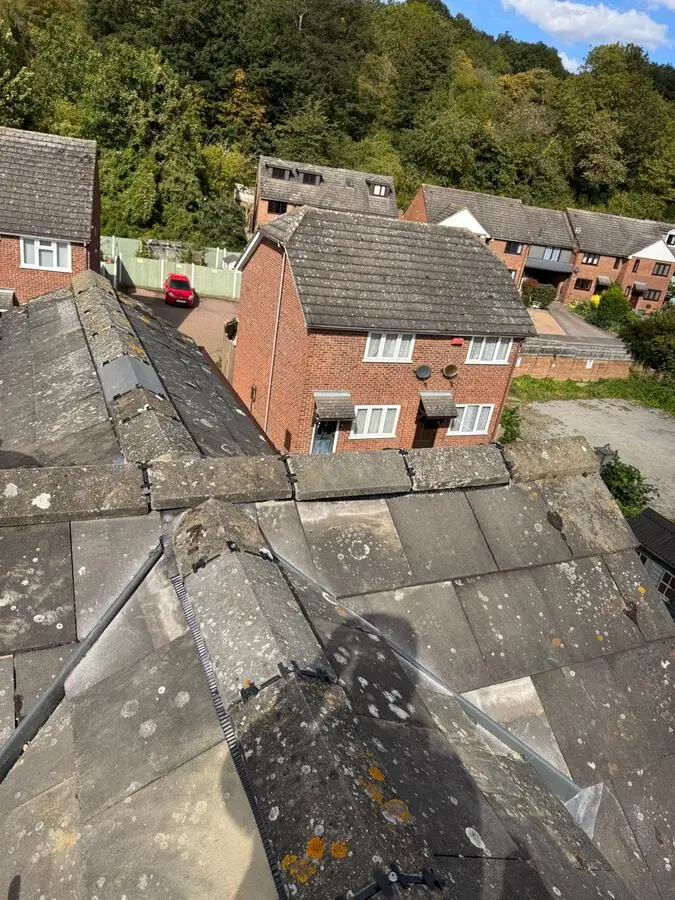 Chimney stack with crumbling flaunching and mortar damage