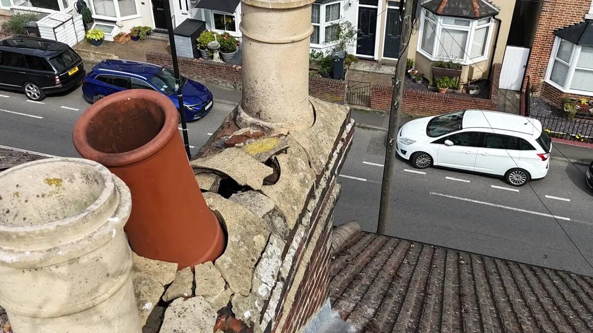 Chimney stack with crumbling flaunching needing repair