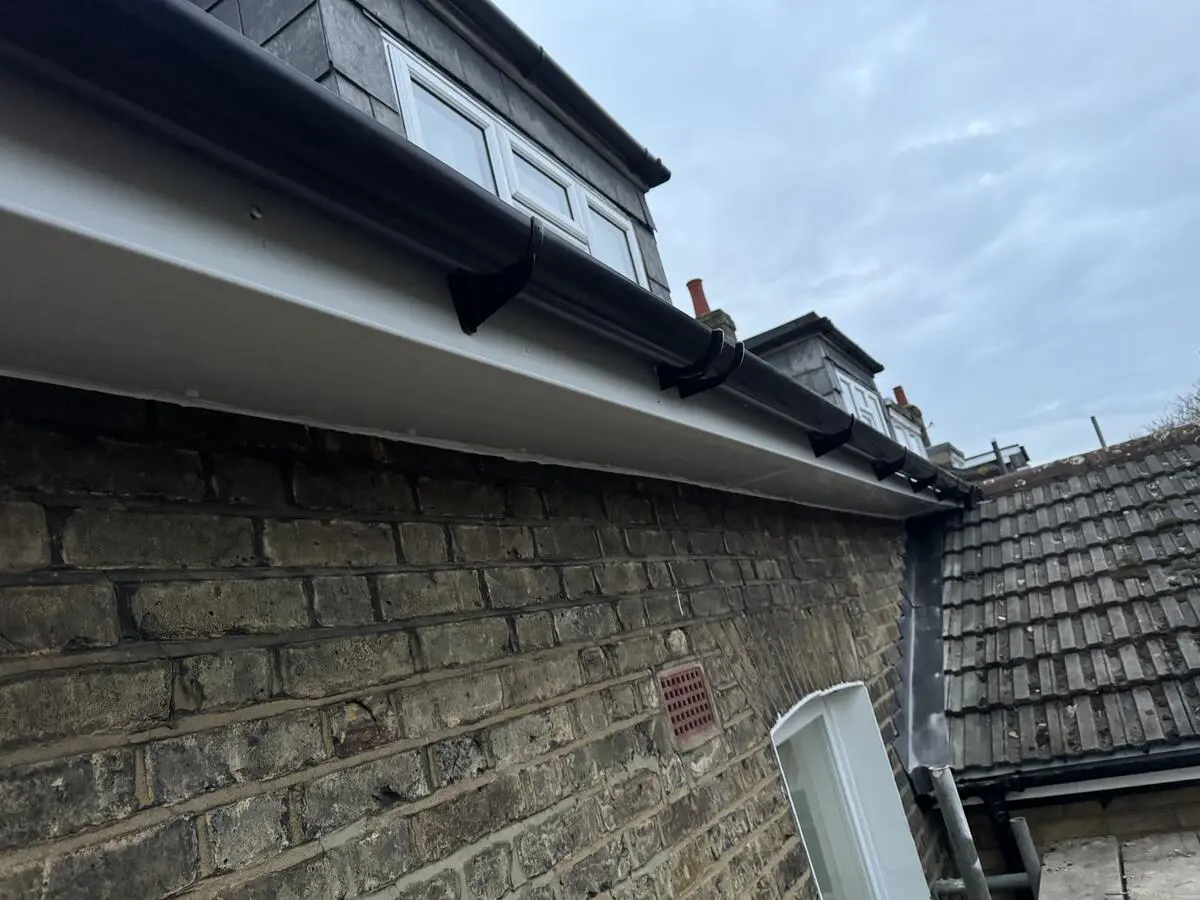 New UPVC fascia board and black guttering