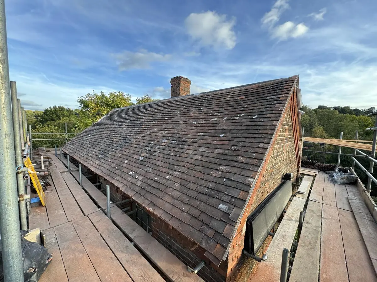 Ikon team stripping damaged roof for emergency repair