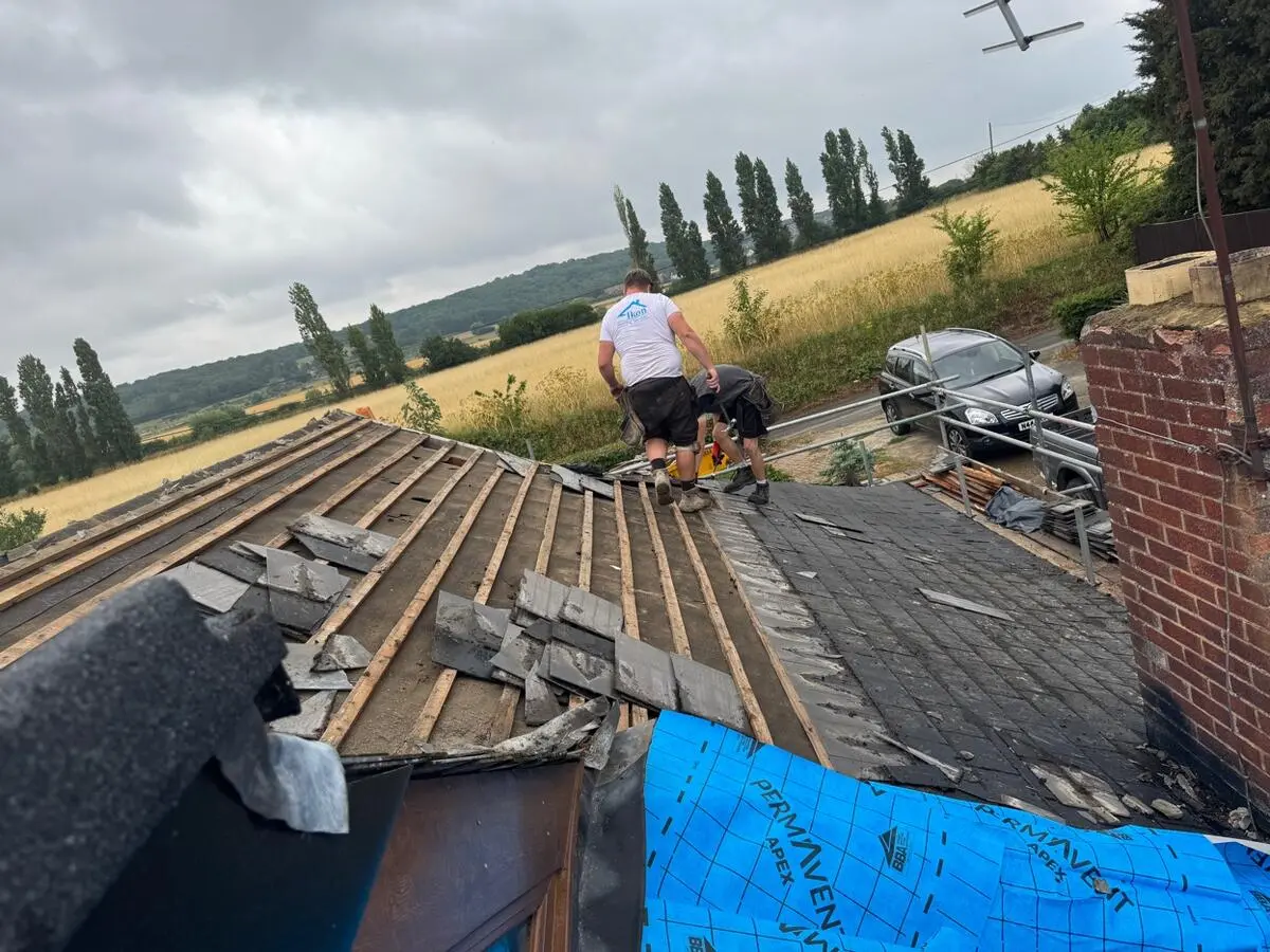 Full roof strip in progress on a Chatham property